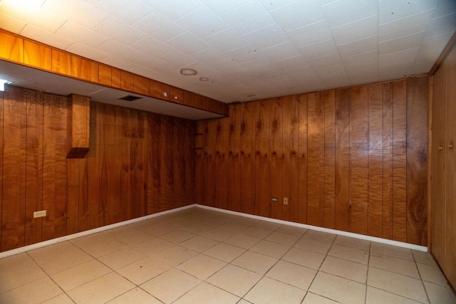 17246 Bernadine St, Lansing, IL 60438 - finished below grade area with visible vents, wood walls, and light tile patterned floors