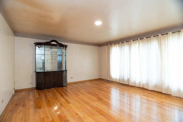 17246 Bernadine St, Lansing, IL 60438 - empty room with hardwood / wood-style floors, baseboards, and visible vents
