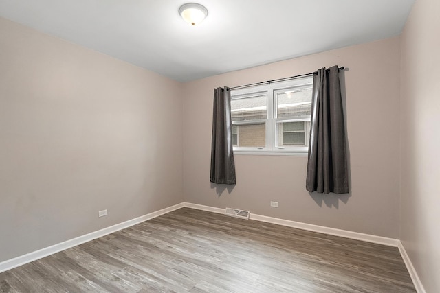 15058 Tripp Ave, Midlothian, IL 60445 - empty room with baseboards and wood finished floors