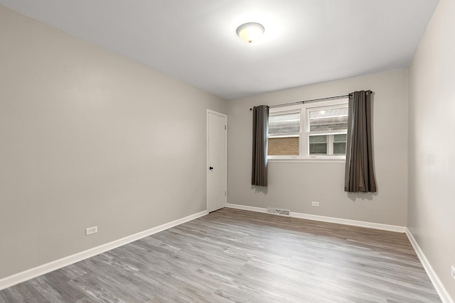 15058 Tripp Ave, Midlothian, IL 60445 - unfurnished room featuring wood finished floors and baseboards