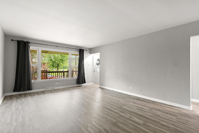15058 Tripp Ave, Midlothian, IL 60445 - unfurnished room with baseboards and wood finished floors