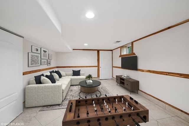 living area featuring visible vents and recessed lighting