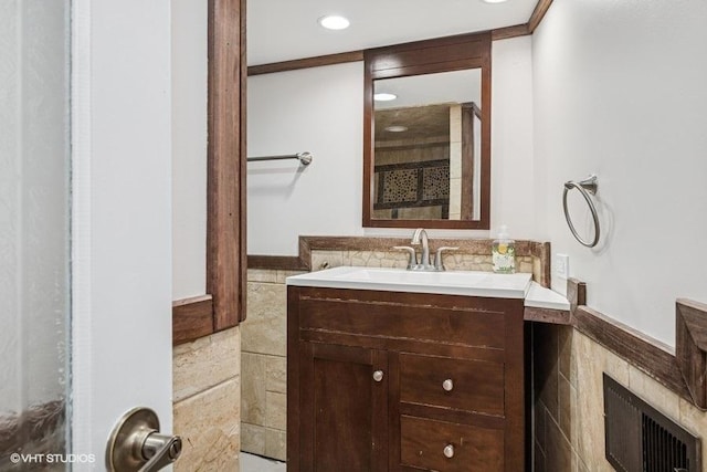 bathroom featuring vanity, recessed lighting, and visible vents