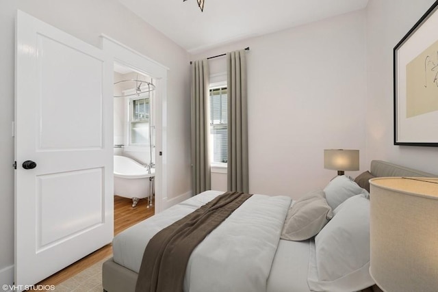 bedroom with light wood-type flooring