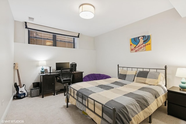 carpeted bedroom featuring baseboards and visible vents