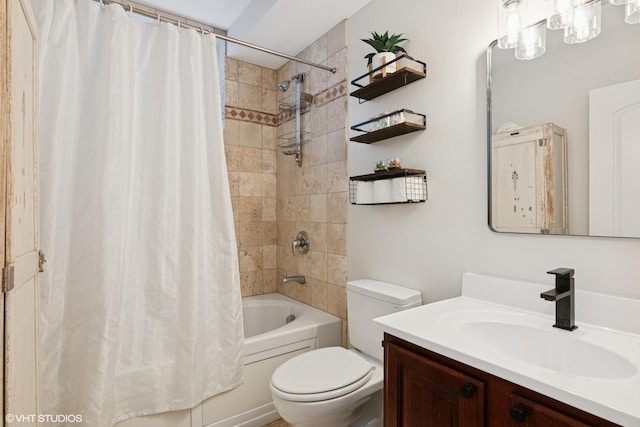 bathroom featuring vanity, toilet, and shower / tub combo