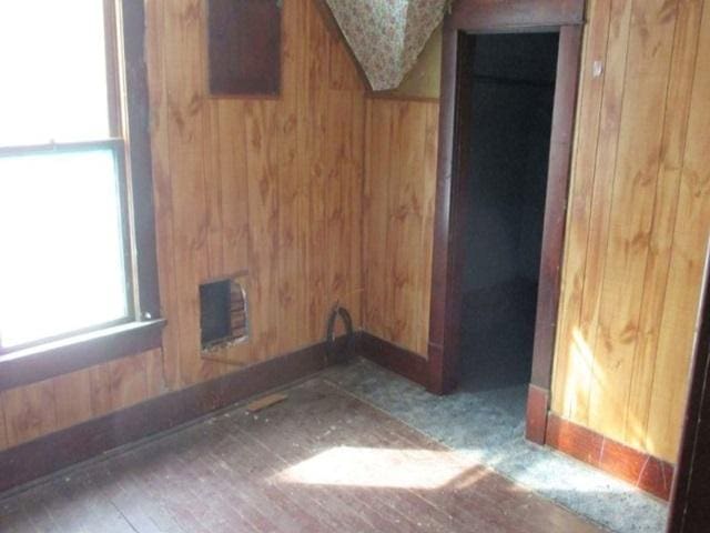 1207 S Main St, Paris, IL 61944 - interior space with wood walls