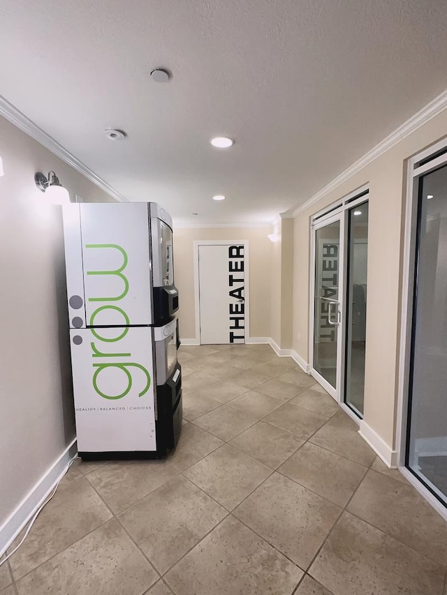 corridor with crown molding, light tile patterned floors, baseboards, and recessed lighting
