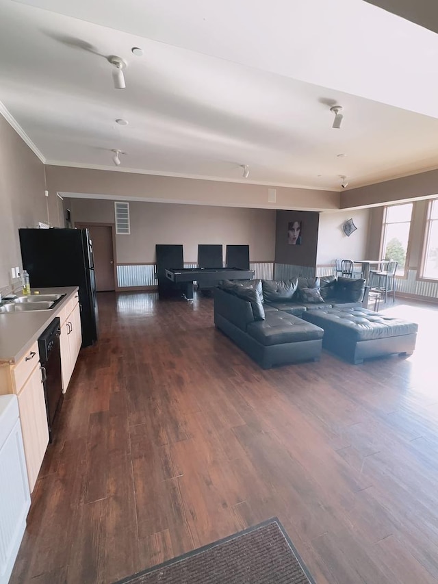 living area with ornamental molding, visible vents, and dark wood-type flooring