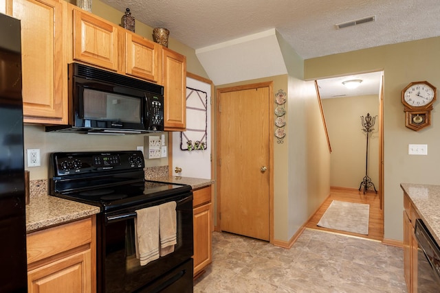 1103 Shingle Oak Ln Unit 3A, Rockford, IL 61107 - kitchen with visible vents, black appliances, a textured ceiling, and light stone counters