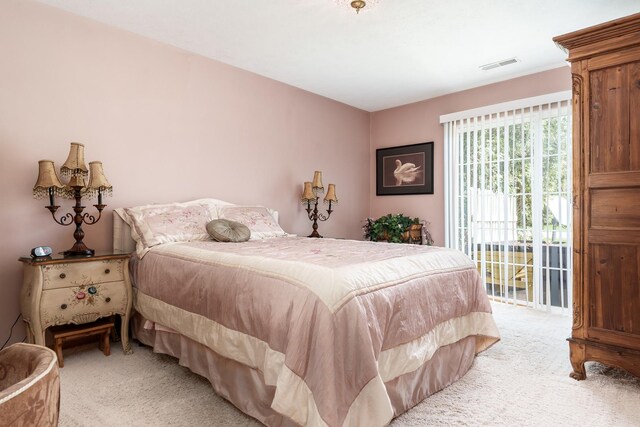 1103 Shingle Oak Ln Unit 3A, Rockford, IL 61107 - bedroom featuring visible vents, access to outside, and light colored carpet