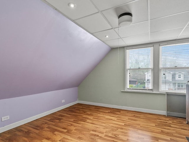 bonus room featuring baseboards, recessed lighting, lofted ceiling, and wood finished floors