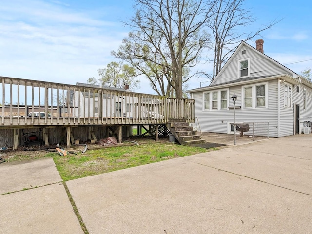 exterior space with a chimney and a deck