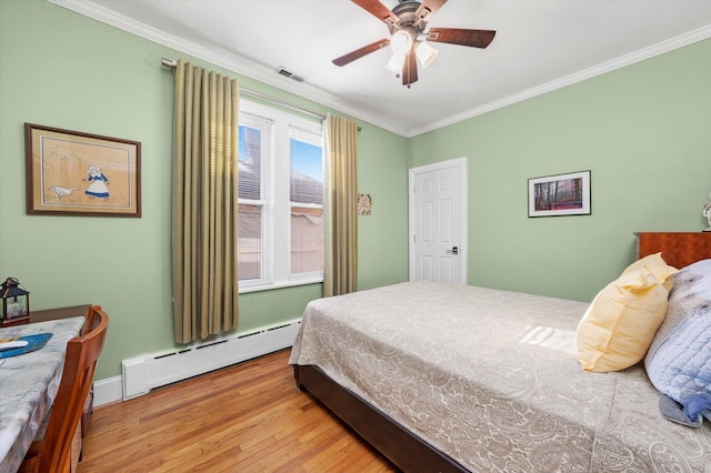3924 W 64th Pl, Chicago, IL 60629 - bedroom with a baseboard heating unit, wood finished floors, ornamental molding, a ceiling fan, and baseboards