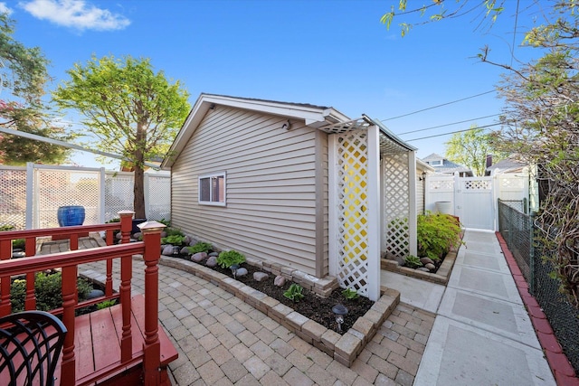 3924 W 64th Pl, Chicago, IL 60629 - view of outbuilding featuring a fenced backyard and a gate