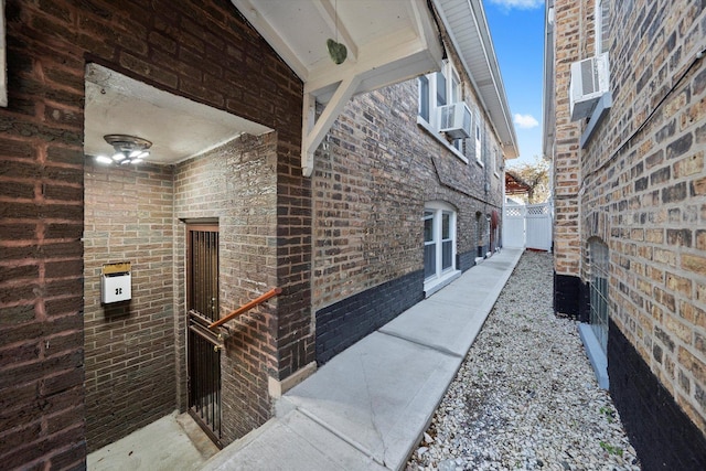 3924 W 64th Pl, Chicago, IL 60629 - view of side of property with cooling unit, brick siding, and fence