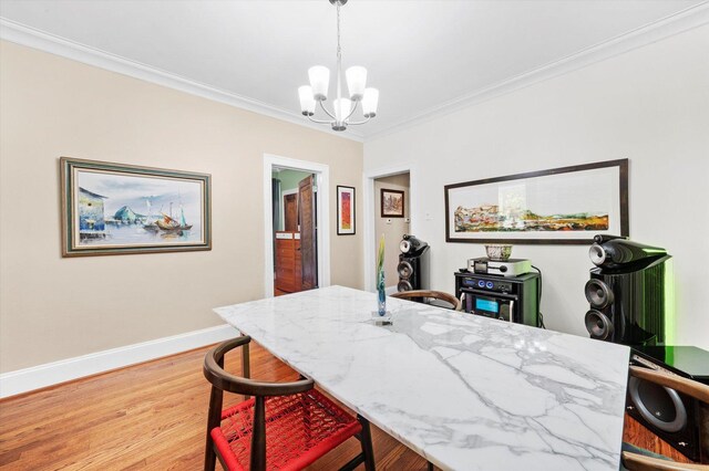 3924 W 64th Pl, Chicago, IL 60629 - dining room featuring a chandelier, crown molding, light wood-style floors, and baseboards