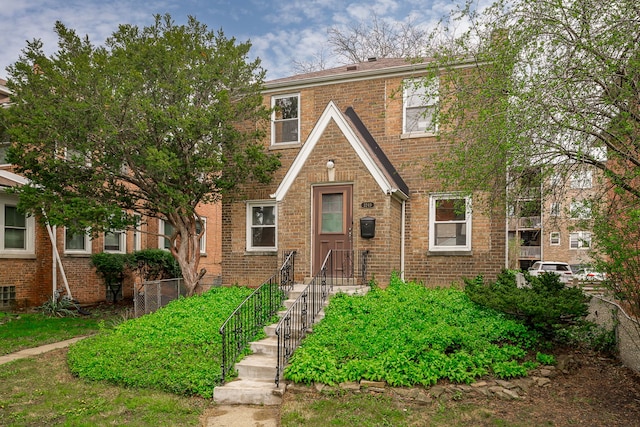 view of front facade featuring brick siding