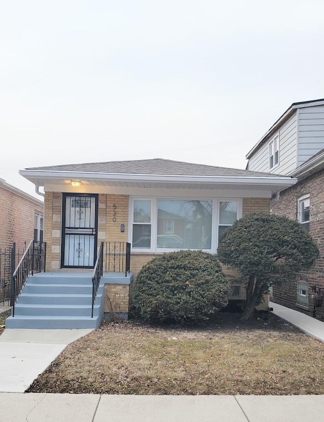 530 E 91st Pl, Chicago, IL 60619 - bungalow-style house featuring a porch and brick siding