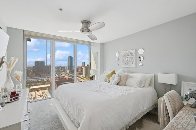 659 W Randolph St Unit 1720, Chicago, IL 60661 - bedroom featuring carpet flooring, a view of city, multiple windows, and a ceiling fan