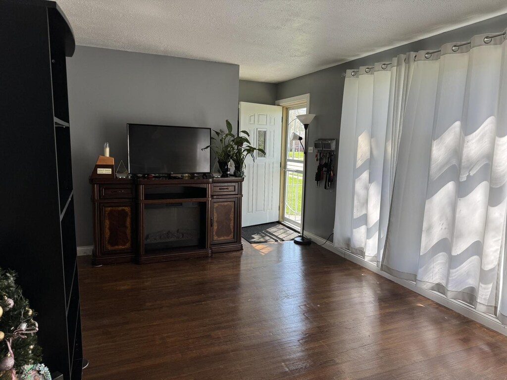 365 Sherry Ln, Chicago Heights, IL 60411 - entrance foyer with baseboards, a textured ceiling, and dark wood finished floors