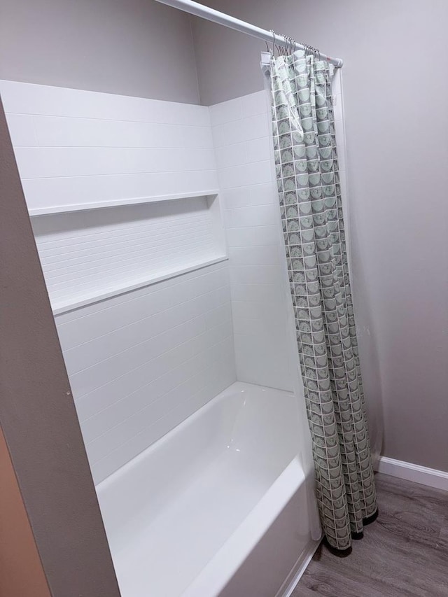 2007 E Vermont Ave, Urbana, IL 61802 - full bath featuring shower / tub combo, wood finished floors, and baseboards