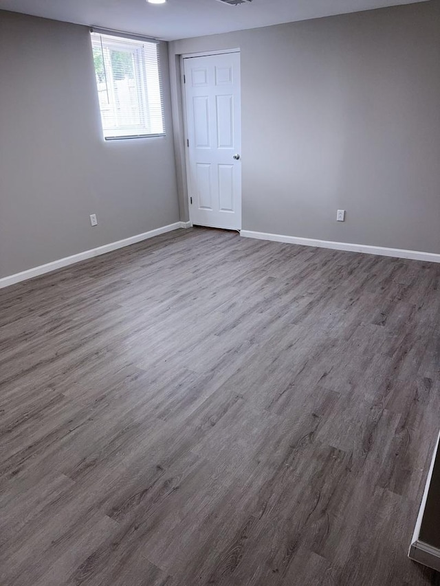 2007 E Vermont Ave, Urbana, IL 61802 - interior space featuring baseboards and dark wood-style flooring
