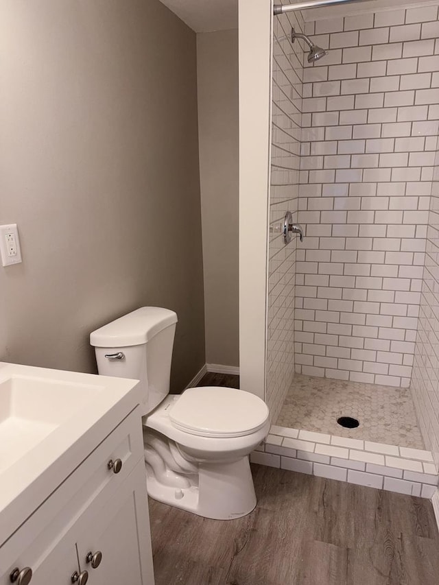 2007 E Vermont Ave, Urbana, IL 61802 - full bathroom featuring wood finished floors, toilet, a shower stall, and vanity