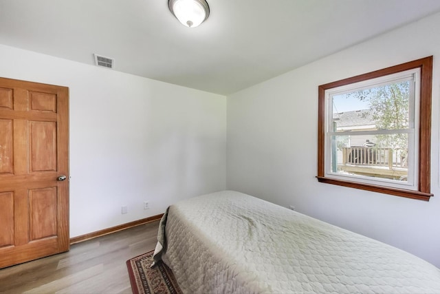 2021 Oak Dr, Mchenry, IL 60050 - bedroom featuring wood finished floors and baseboards