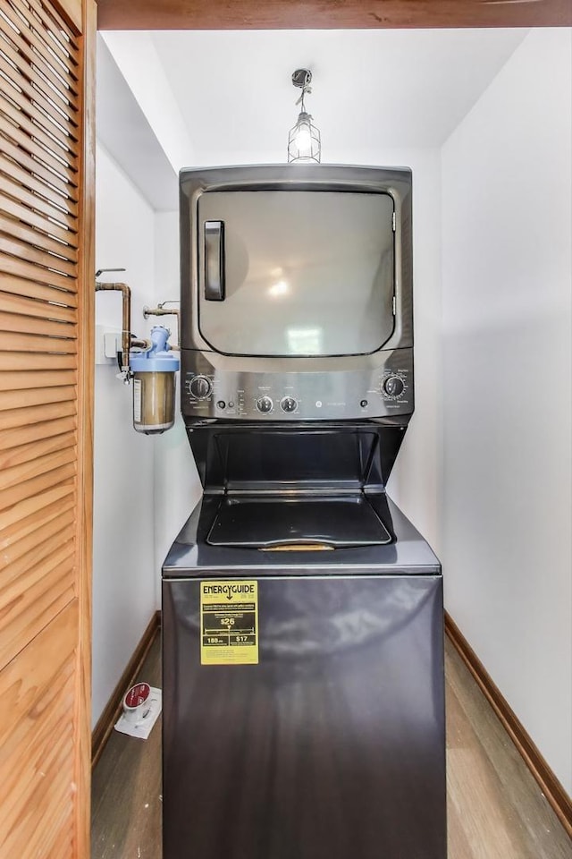 2021 Oak Dr, Mchenry, IL 60050 - washroom with stacked washer / dryer and wood finished floors