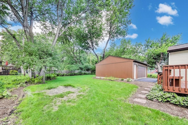2021 Oak Dr, Mchenry, IL 60050 - view of yard featuring an outdoor structure, a garage, and a wooden deck