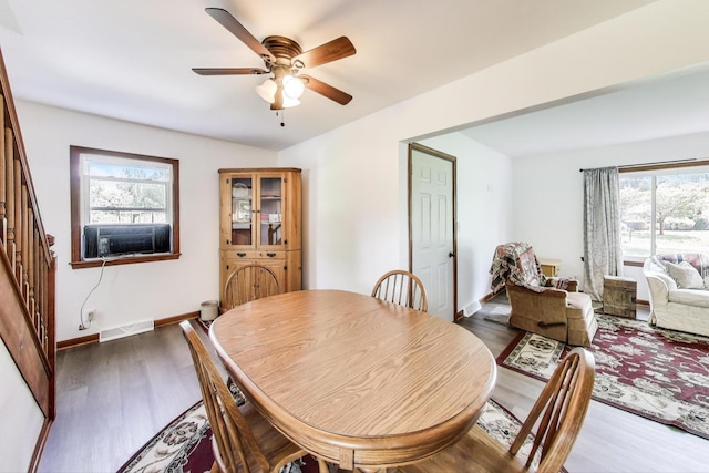 2021 Oak Dr, Mchenry, IL 60050 - dining area featuring cooling unit, ceiling fan, wood finished floors, and stairway