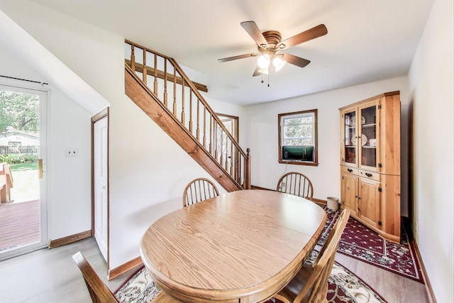 2021 Oak Dr, Mchenry, IL 60050 - dining space with light wood finished floors, stairs, and a ceiling fan