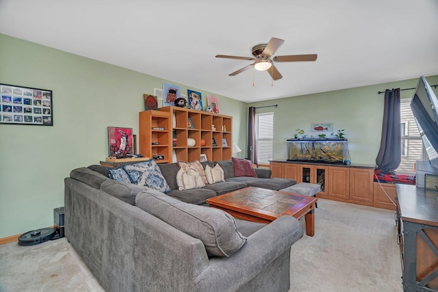 185 Wedgeport Cir, Romeoville, IL 60446 - living area featuring light carpet, a ceiling fan, and a healthy amount of sunlight