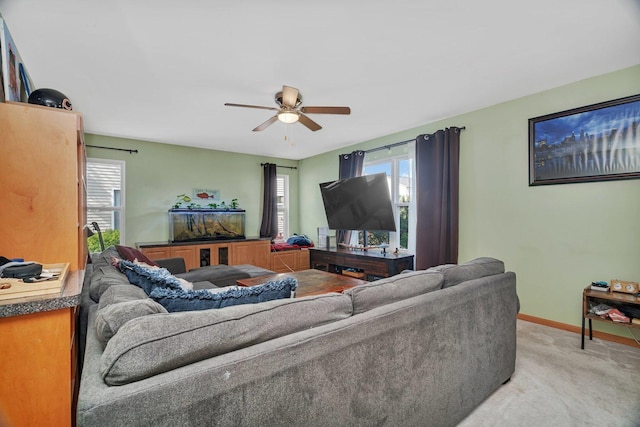 185 Wedgeport Cir, Romeoville, IL 60446 - living area featuring light carpet, baseboards, and a ceiling fan