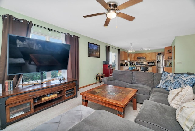 185 Wedgeport Cir, Romeoville, IL 60446 - living area with plenty of natural light, baseboards, and a ceiling fan