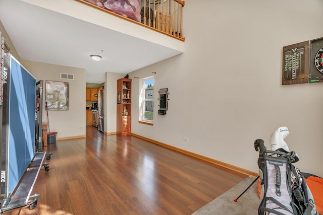 185 Wedgeport Cir, Romeoville, IL 60446 - interior space featuring visible vents, wood finished floors, and baseboards