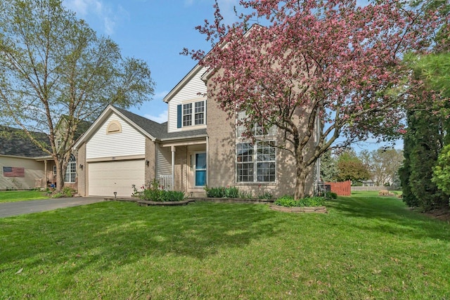 185 Wedgeport Cir, Romeoville, IL 60446 - traditional home with a garage, driveway, brick siding, and a front yard