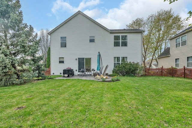 185 Wedgeport Cir, Romeoville, IL 60446 - back of property with a lawn, a patio area, and fence