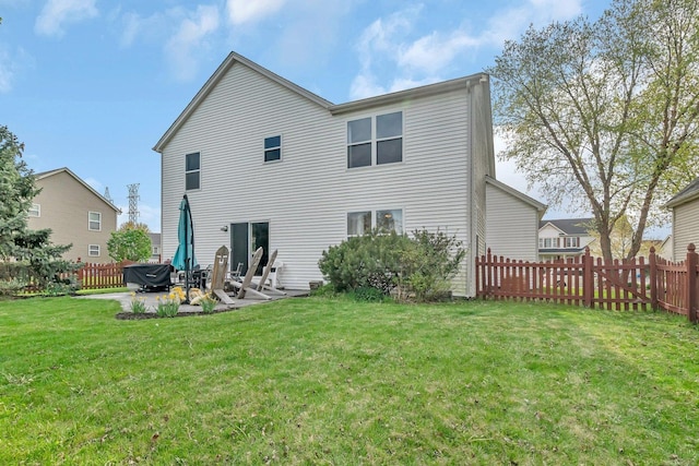 185 Wedgeport Cir, Romeoville, IL 60446 - rear view of house with a lawn, a patio, and a fenced backyard