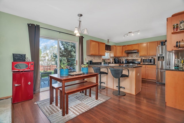 185 Wedgeport Cir, Romeoville, IL 60446 - dining area with an inviting chandelier and dark wood finished floors