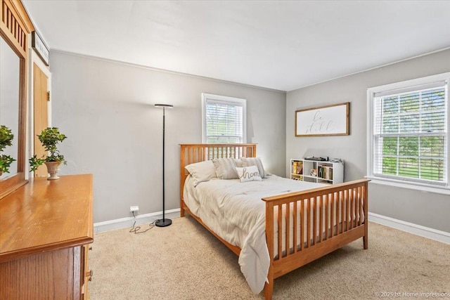 bedroom with carpet flooring and baseboards
