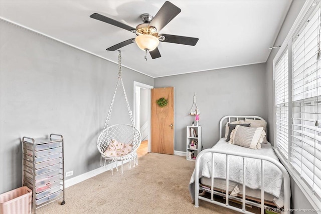 bedroom featuring carpet floors, a ceiling fan, and baseboards