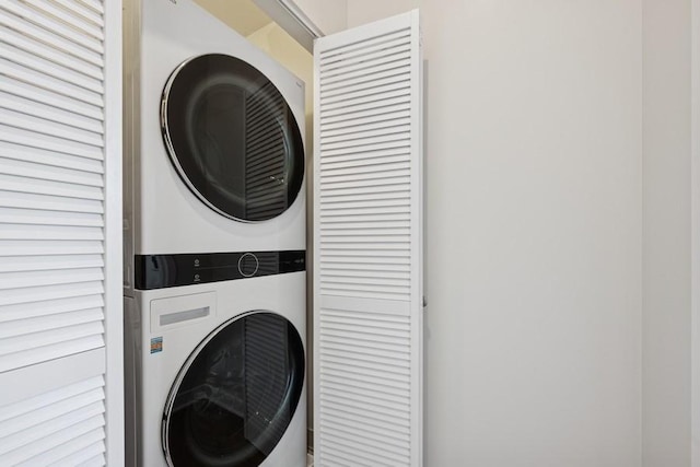 laundry area with laundry area and stacked washer and dryer