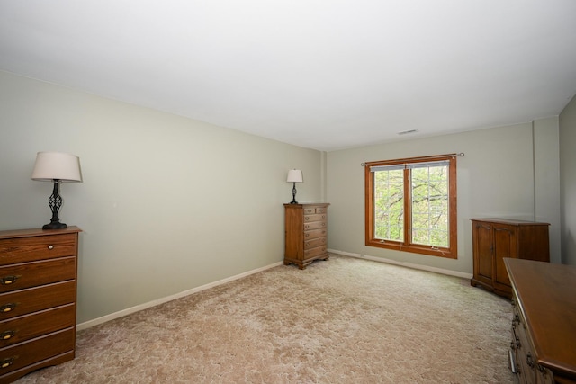 carpeted bedroom with baseboards