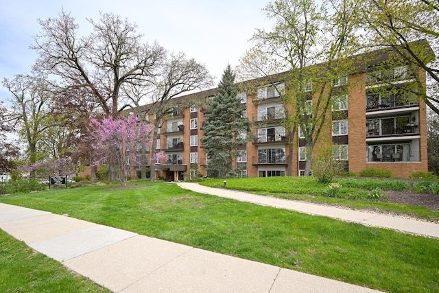 view of community featuring a lawn