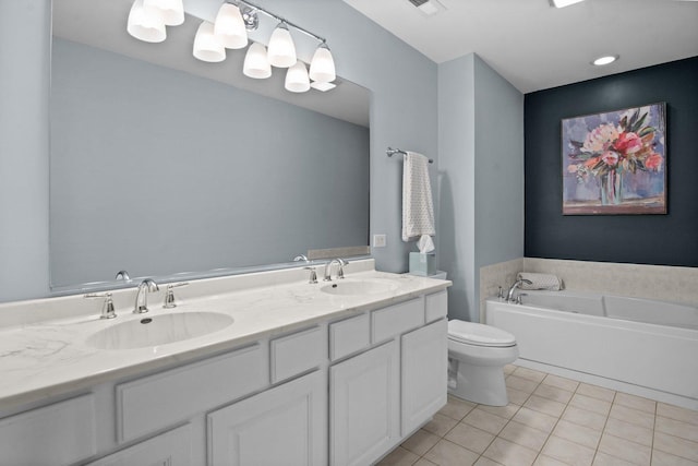 full bathroom featuring a garden tub, toilet, tile patterned flooring, and a sink