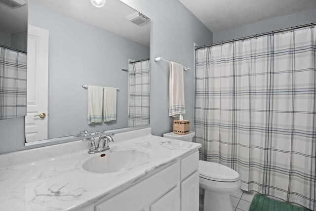 bathroom featuring visible vents, toilet, and vanity