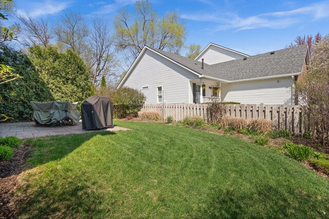 view of yard with fence and a patio area