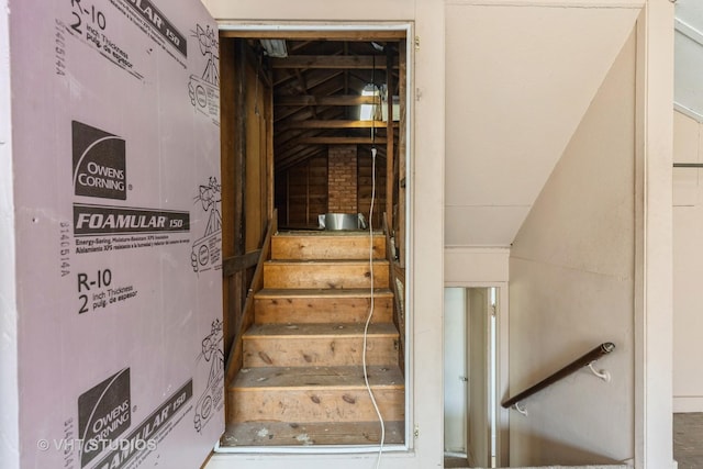 stairway with lofted ceiling